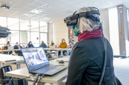 VR headset and students in the background
